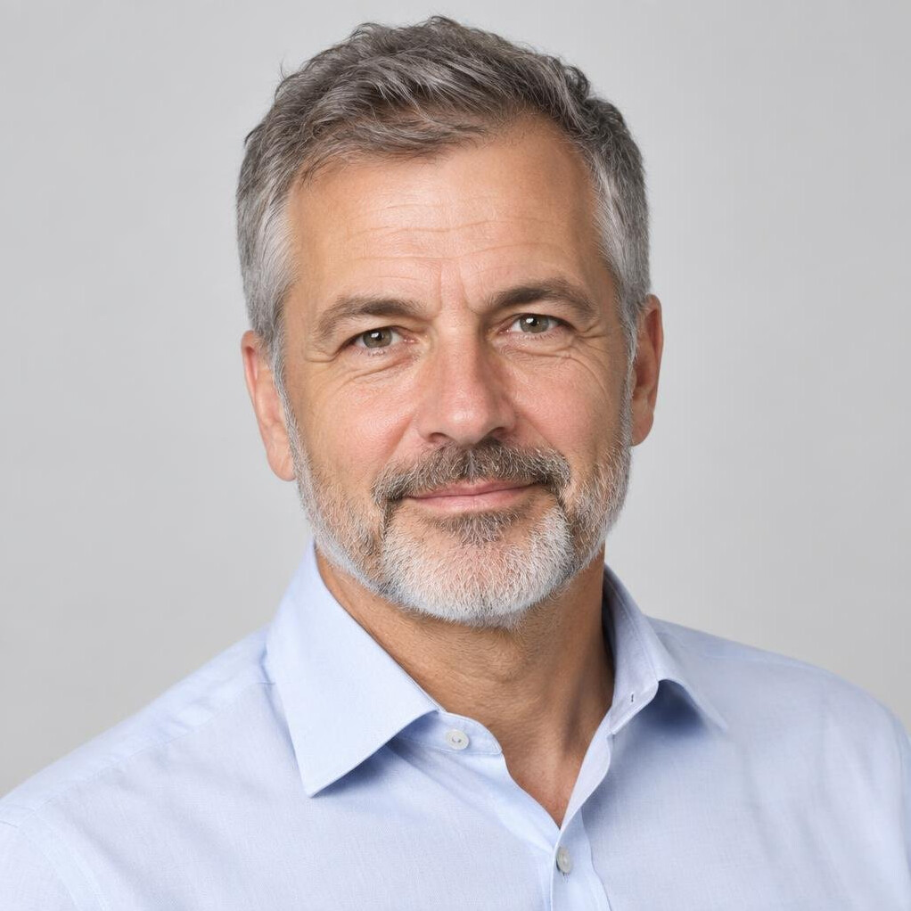 Studio portrait of a Swiss man in his fifties with a short beard